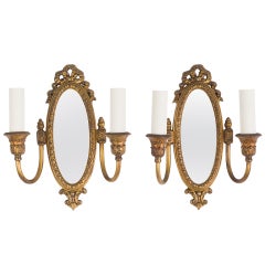 A pair of double-light mirrorback sconces