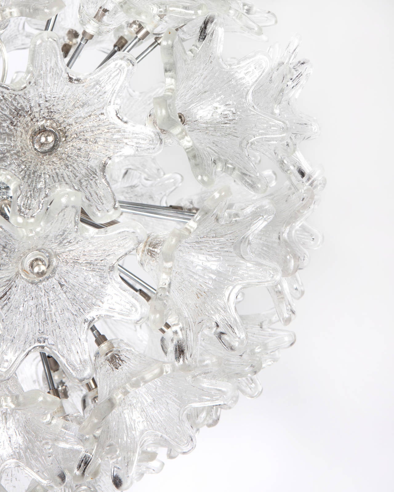AHL3883

Circa 1960
A nickel sputnik chandelier with three-dimensional foliate glass pieces. Due to the antique nature of this fixture, there may be some nicks or imperfections in the glass.

Dimensions:
Current height: 54-3/4