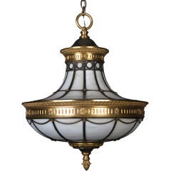 An Antique Bronze and Leaded Glass Chandelier