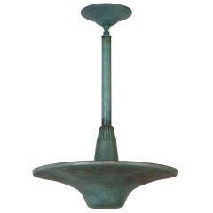 A verdigris copper uplight pendant