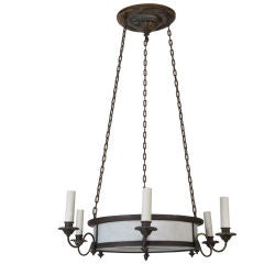 An antique bent glass and blackened brass chandelier