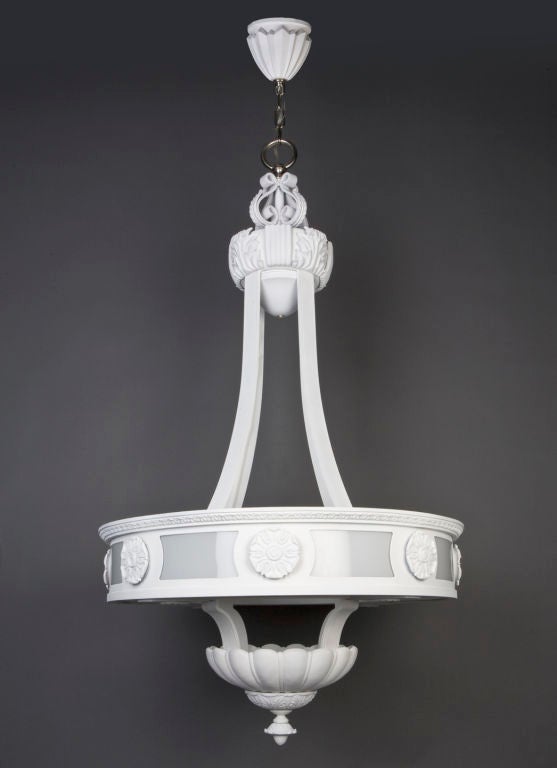 AHL3574<br />
A large white enameled, cast and wrought metal chandelier with opal glass, and foliate details.<br />
<br />
Current height: 99-1/4
