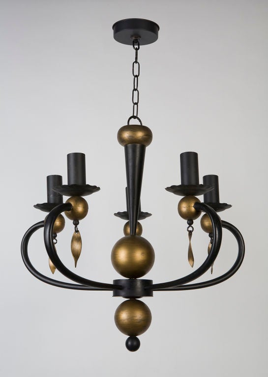 AHL3563<br />
A vintage five-light gold-washed and black enameled iron chandelier.<br />
<br />
Current height: 34-3/4
