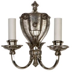 A single antique nickeled bronze sconce