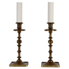 A pair of candelstick lamps