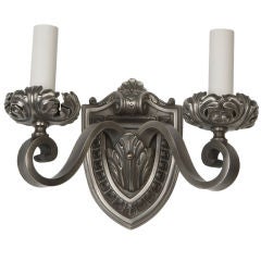 A nickeled cast iron sconce