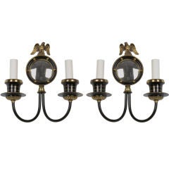 A pair of black enamel and brass sconces