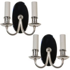 A pair of silverplate mirrorback sconces