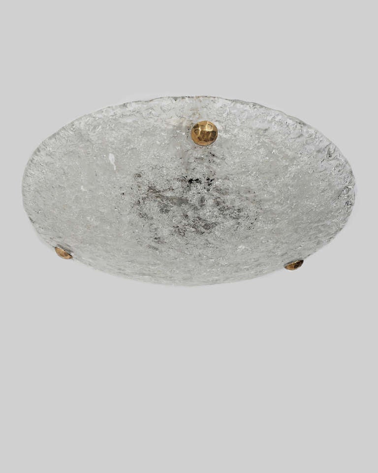 Circa 1960.  A textured cast glass dome flush mount with brass fittings attributed to the German maker Kaiser Leuchten. Due to the antique nature of this fixture, there may be some nicks or imperfections in the glass.

DIMENSIONS
Overall: 4-3/4