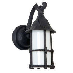A pair of cast iron wall lanterns