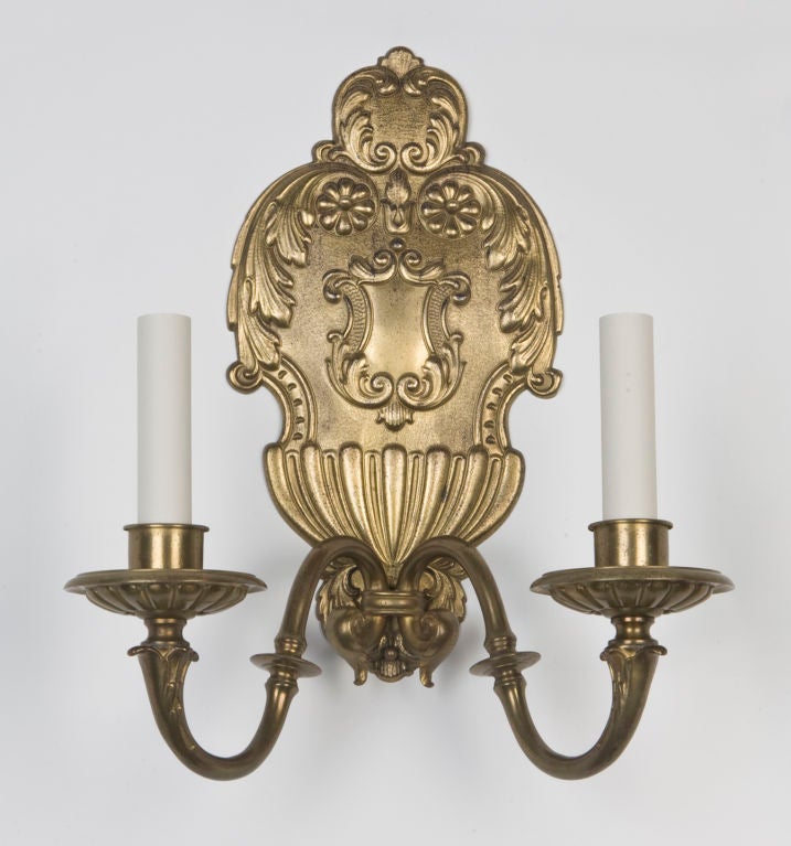 AIS2724

From an original 1716 English design of Edward Gore, a pair of double-light sconces retaining their original gilding over bronze and copper. They are well chased with crisp details. Signed by the maker Sterling Bronze Co.