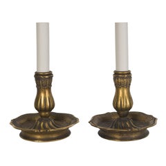 A pair of bronze baroque candelabra lamps signed by E. F. Caldwell 