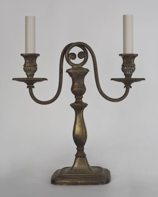 ATL1834

A pair of double-light curved-arm candelabra in their original aged silverplate finish. By the New York maker E. F. Caldwell Co.

Overall: 16-3/4