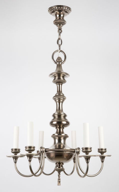 AHL3060

A six-light dark nickel chandelier with deeply gadrooned cups and stem. The terminal loop is in the form of a pinecone. By the New York maker E. F. Caldwell. From a Cleveland, Ohio estate.

Current height: 55-1/4