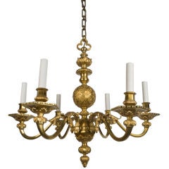 A six-light gilt chandelier by N. Burt and Co.