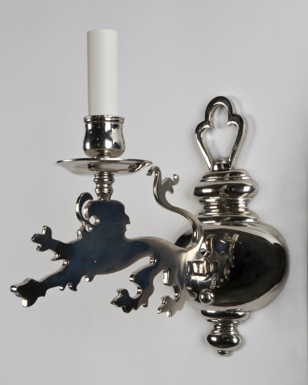 AIS2754

A pair of single-light sconces finished in nickel, having unusual silhouette arms in the form of rampant lions springing from stout baluster backplates. Signed by the New York maker E. F. Caldwell. From a North Shore Massachusetts