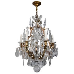 A gilt six-light crystal chandelier