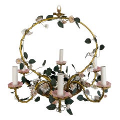 A six-light brass and ceramic floral chandelier