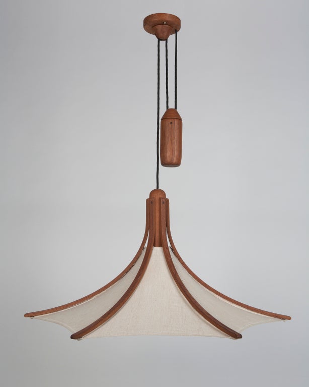 AHL3655,

a German teak and linen pendant with a counterweighted rise-and-fall suspension.

Measures: Minimum height 36