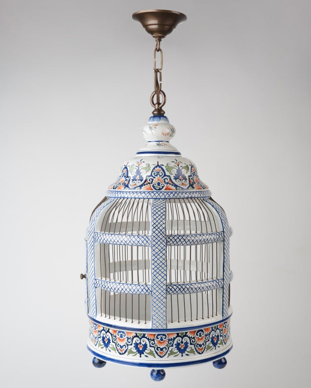 AHL3670

A birdcage-form lantern with blue, red, and green painted details over a white ground.

Dimensions:
Current height: 59