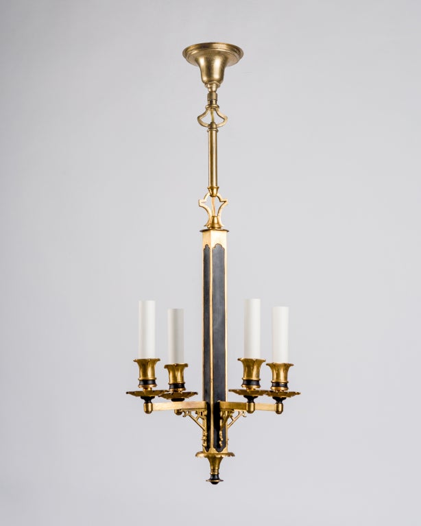 AHL3696

A four light chandelier on long stem, in gold and black enamel.

Current height: 45-1/4
