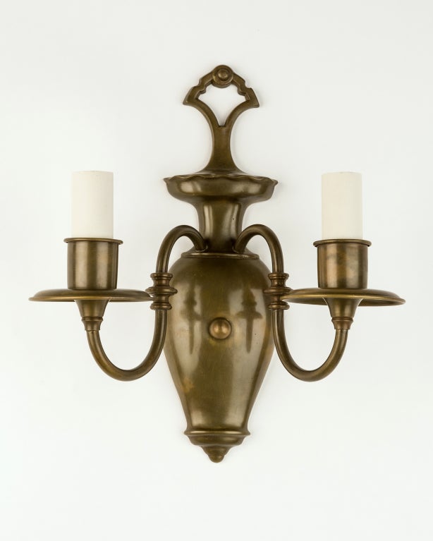 AIS2796
A pair of darkened brass double light sconces with urn form backplates and slender S-curving arms.

Dimensions:
Overall: 11