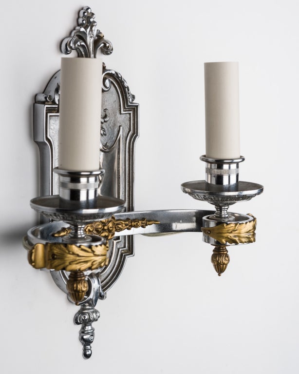 American A Pair Of Chrome And Brass Sconces