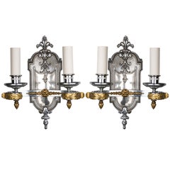 A Pair Of Chrome And Brass Sconces