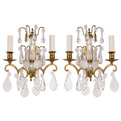 A Pair Of Brass And Crystal Sconces