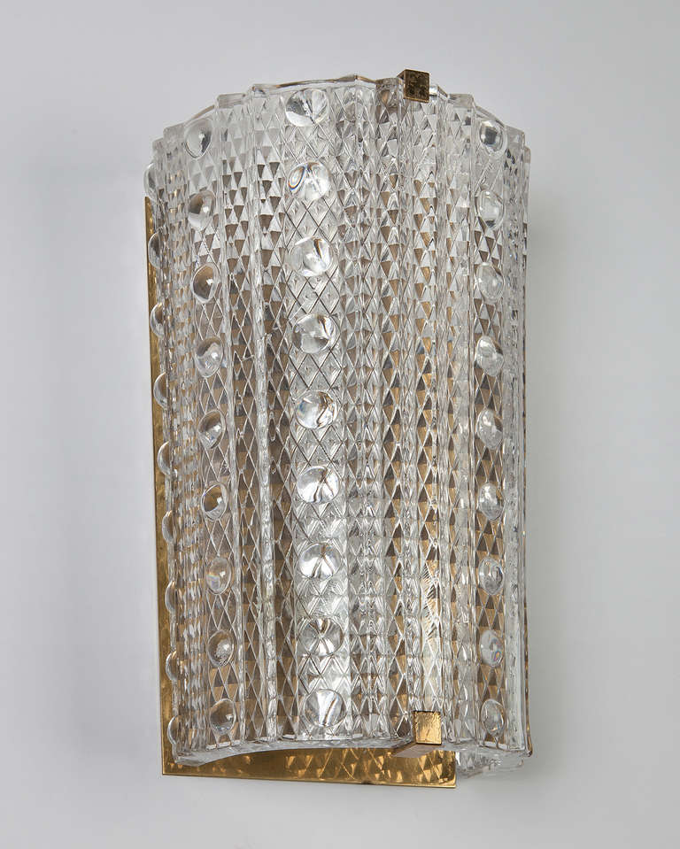 AIS2880

Circa 1950
A pair of textured glass sconces by Carl Fagerlund for the Swedish glassmaker Orrefors. In their original aged brass finish. Due to the antique nature of this fixture, there may be some nicks or imperfections in the
