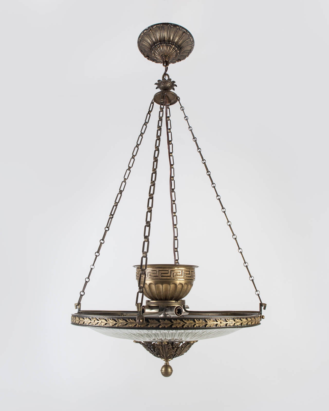 AHL3919

Circa 1900
A regency style chandelier with a cut glass lens held in an age-darkened brass frame. Due to the antique nature of this fixture, there may be some nicks or imperfections in the glass.

DIMENSIONS
Minimum height: