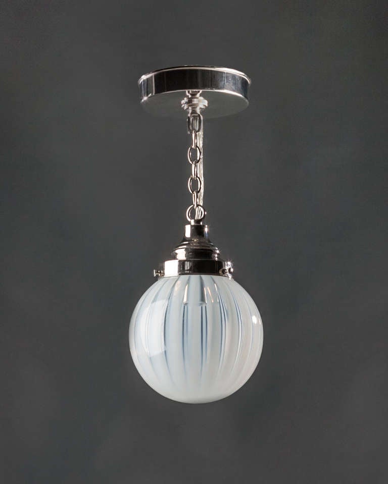 AHL3761

A striped vaseline glass pendant on polished nickel fittings made in the Remains Lighting workshop. Due to the antique nature of this fixture, there may be some nicks or imperfections in the glass.

DIMENSIONS
Current height: