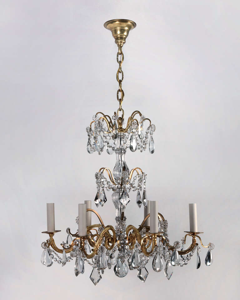 AHL3837<br />
<br />
A fine antique six light chandelier having a bright gilded brass frame and cut crystal dressing. Due to the antique nature of this fixture, there may be some nicks or imperfections in the glass.<br />
<br />
Dimensions:<br