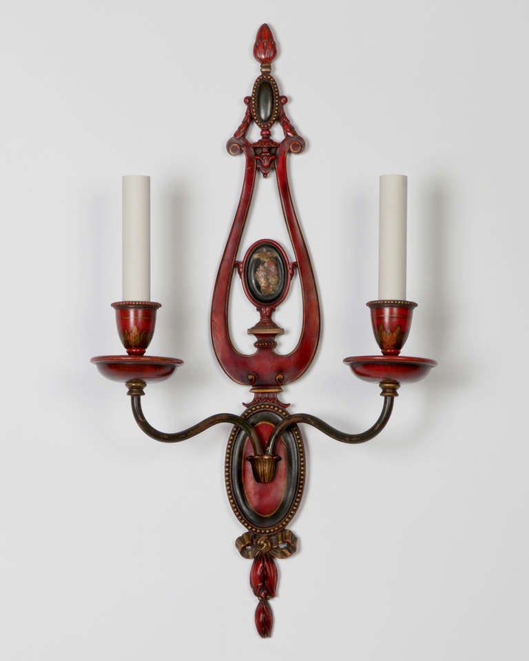 AIS2891

A pair of very fine double light Chinoiserie style sconces. The delicate lyre-form backplates are finished in their original red and black enamel, punctuated with exceptional hand-painted vignettes. Signed by the New York Maker E. F.
