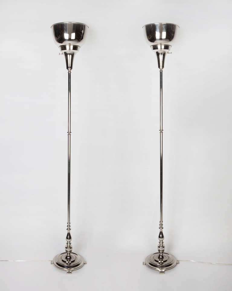 AFL1829

A pair of antique nickel plated torchieres with subtle baluster form standards and full dome shades. 

Dimensions

Overall: 64-3/4