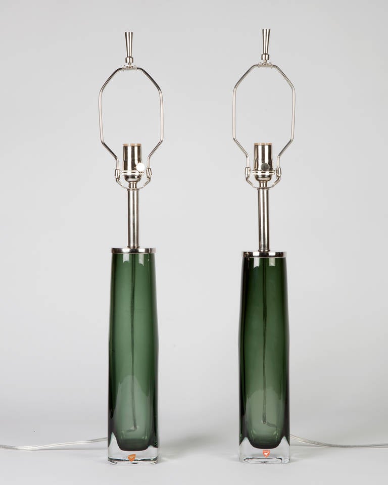 ATL1878

A pair of square-bottom green glass table lamps with polished nickel fittings designed by Carl Fagerlund for the Swedish glassmaker Orrefors. Due to the antique nature of this fixture, there may be some nicks or imperfections in the