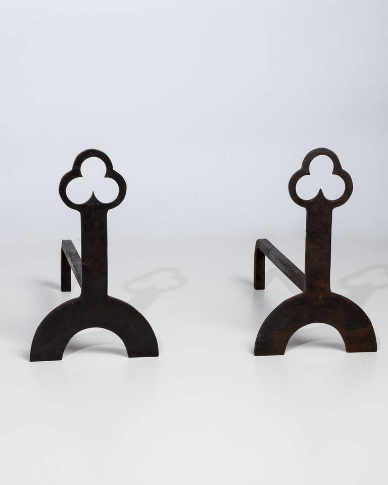 AFP0506

A pair of antique blackened wrought iron andirons pierced with a gothic style trefoil finial atop rectangular bodies and semi-circle legs. Circa 1920s.

DIMENSIONS:
Overall: 16