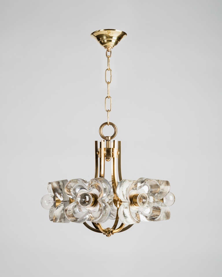 AHL3797

A six-light chandelier with massive cast glass flowers on a solid brass frame. Due to the antique nature of this fixture, there may be some nicks or imperfections in the glass.

DIMENSIONS
Current height: 42-1/4