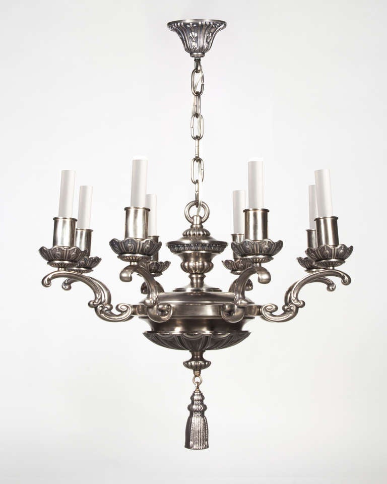 AHL3792
An antique eight-light chandelier having neoclassical foliate details in a darkened hand-rubbed nickel finish.

Dimensions:
Current height: 58