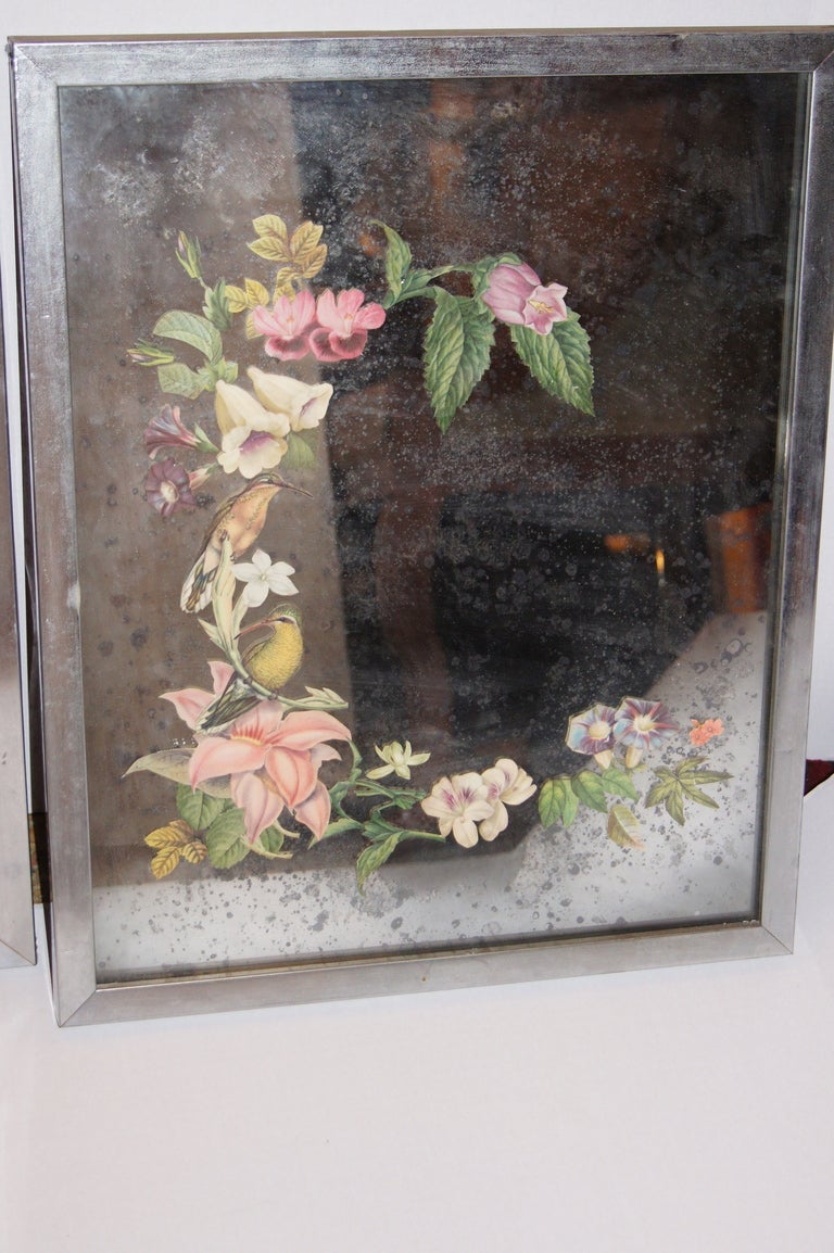 Pair of vintage decopage mirror panels with floral decoration and birds. Silver leaf frame.
21