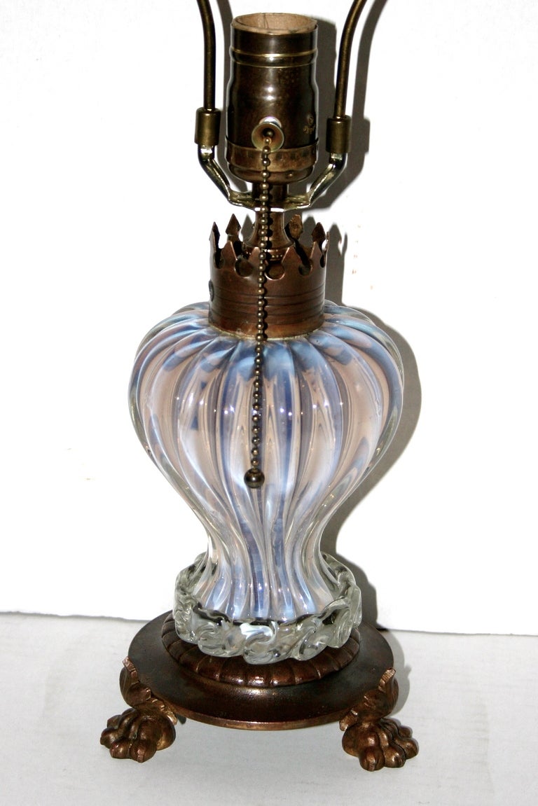 A circa 1910 murano glass table lamp with bronze base.

Measurements:
Height of body: 8