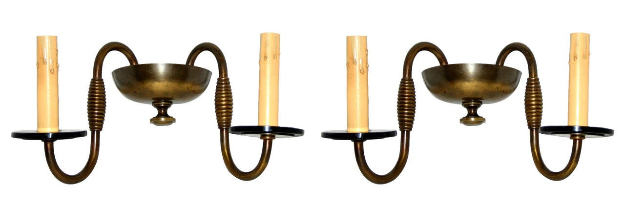 Pair of circa 1930s French Art Deco patinated bronze double light sconces with glass bobeche.
Measurements:
Height 7