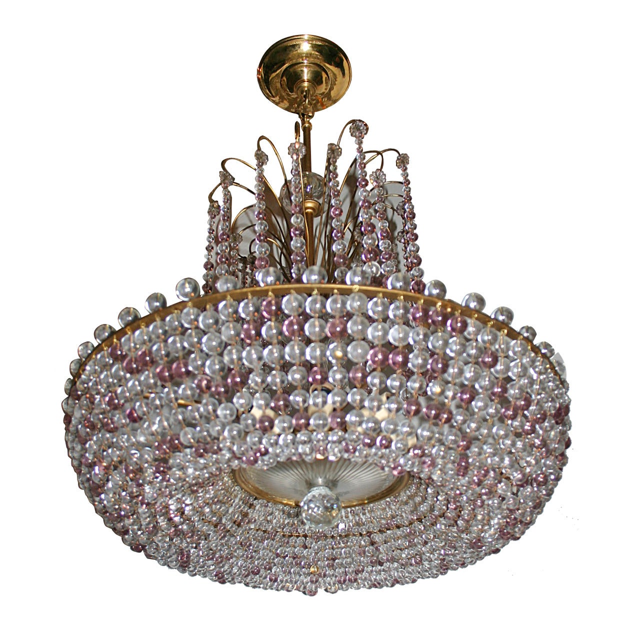 A circa 1940 French crystal chandelier with amethyst and clear crystals, interior lights.
Measurements:
21