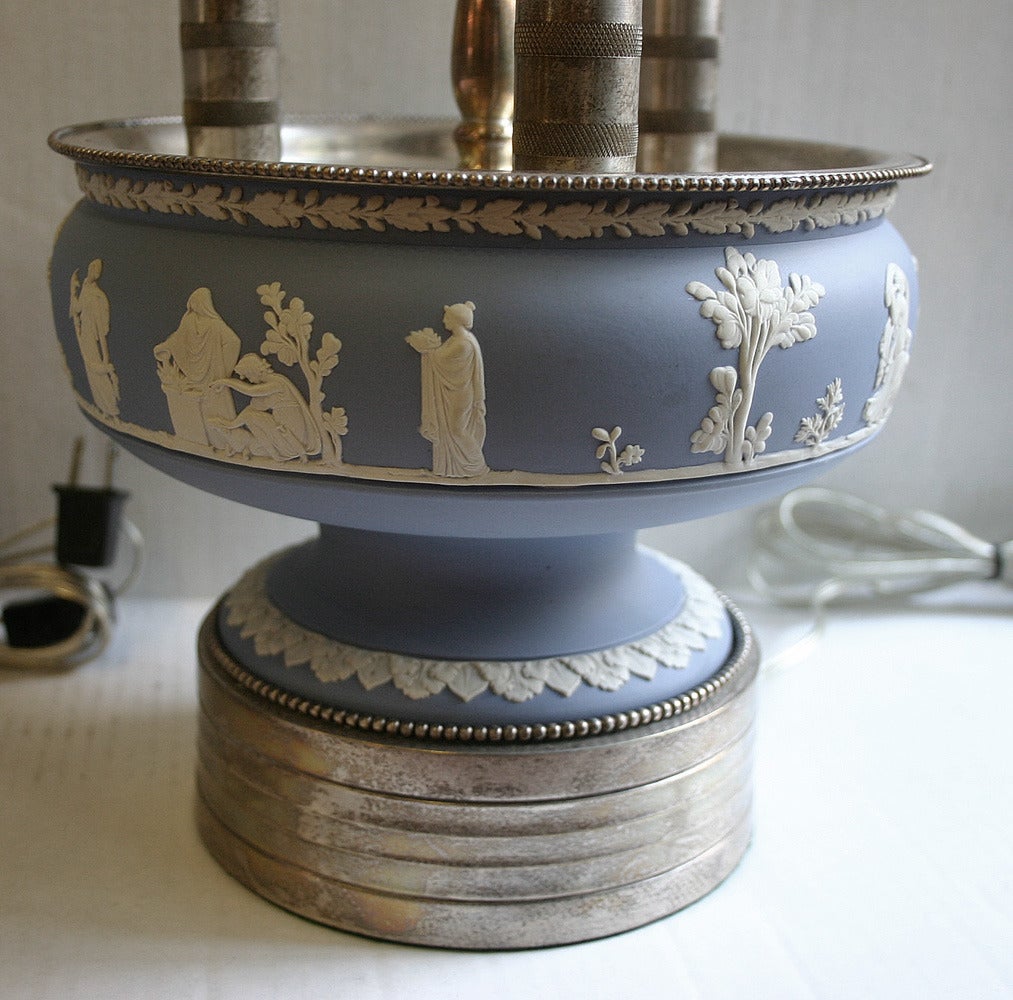 Pair of 1920s English silver plated Wedgwood lamps. Priced and sold as pair.

Measurements
Height to rest of shade: 22