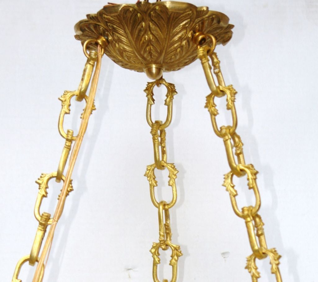 French gilt bronze and alabaster light fixture with three interior candelabra lights, with gilt bronze mounts in neoclassic style, , circa 1920s
Measurements:
Height 27 in.
Diameter 18 in.
