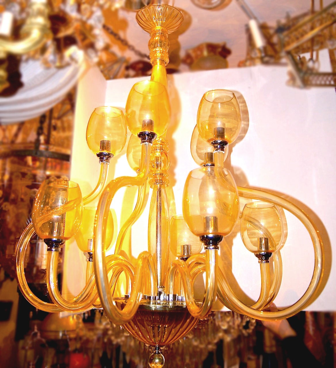 Italian, Murano glass chandelier with twelve lights, in two levels, circa 1960. 
Measures: 34″ diameter, 42″ min. drop.