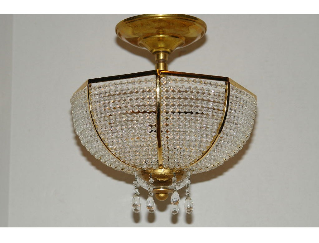 A circa 1930s French beaded crystal ceiling fixture with interior lights.

Measurements:
Height 11