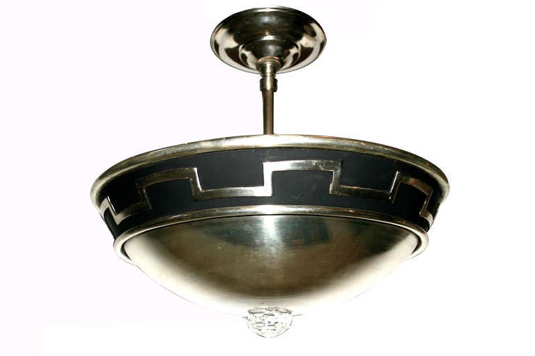 Set of 11, circa 1930s silver plated neoclassic style light fixtures with four interior lights each, crystal inset at bottom.
Measurements:
Diameter: 14.75