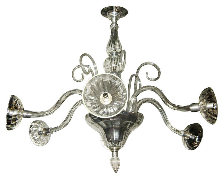 A circa 1960's Moderne six-arm Murano chandelier with scrolling decoration on body.

Measurements:
Minimum drop: 36