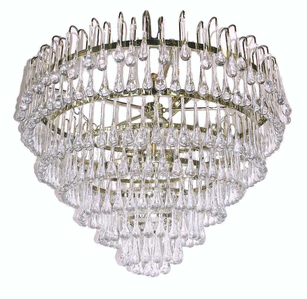 A circa 1960s Italian glass drop chandelier with seven concentric layers of gilt metal with blown glass pendants.
12 lights.